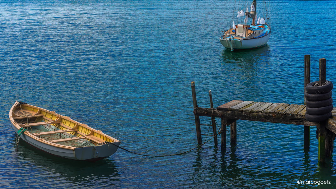 ROWBOAT AND SAILBOAT PORT CHALMERS NEW ZEALAND 